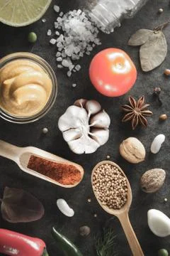 Herbs and spices at table Stock Photos