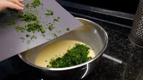Herbs Being Added to Beaten Eggs – Cooking and Meal Preparation with Fresh Video stock 302687431