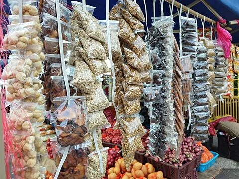 Herbs for cooking in small packets in plastic and hanging Stock Photos