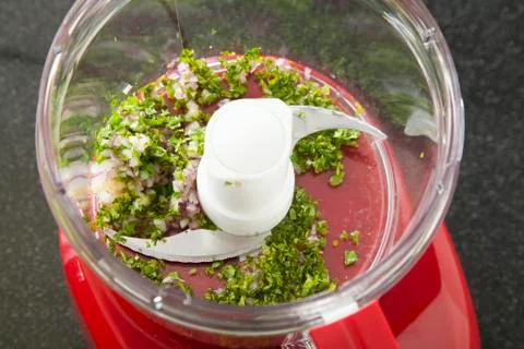 Herbs Pulsed in a Food Processor; Step for Making Salsa Stock Photos