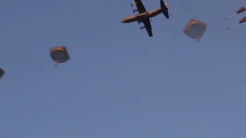 Hercules C-130 dropping parachutists over Italy Stock Footage 84883956