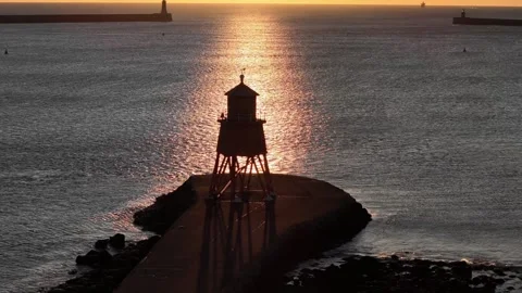 Herd Groyne Lighthouse, Tynemouth Orbiting Shot At Sunrise, No2 Stock Footage 247994151