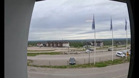 Herd of reindeer walking in front of resort hotel in Lapland Finland Vidéo 340960125