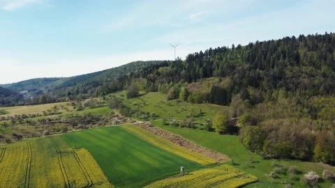 A herd of sheep on the background of a hill with a wind turbine Stock Footage 154369467