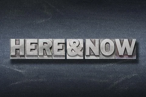 Here and now den Stock Photos