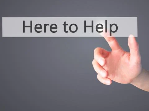 Here to Help - Hand pressing a button on blurred background concept . Busines Stock Photos