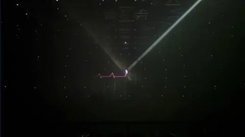 Here is a laser effect illustrating a heart rhythm, with lights forming a Stock Footage 297054279