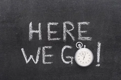 Here we go watch here we go exclamation handwritten on chalkboard with vin... Stock Photos