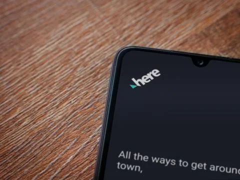 HERE WeGo app launch screen with logo on the display of a black mobile smartp Stock Photos