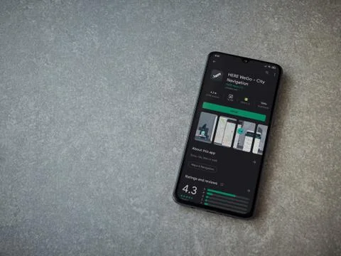 HERE WeGo app play store page on the display of a black mobile smartphone on  Stock Photos