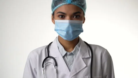 Here for you. Close up of attractive young female doctor with stethoscope Stock Footage 145724545
