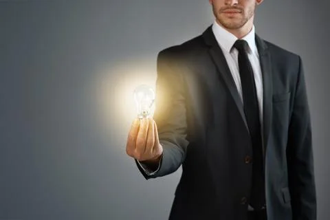 Heres an idea, now lets make it happen. Cropped studio shot of a businessman 스톡 사진