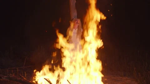 Heretic white witch burning at the stake at night Stock Footage 140915708