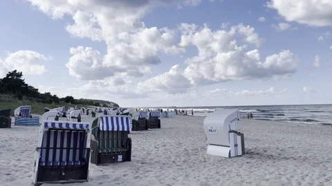 Heringsdorf: Clouds over the imperial beach with beach chairs, 4K Stock Footage 280681540