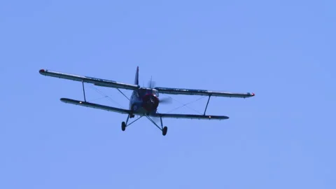 Heritage Utility Plane Antonov AN-2 Banking In Clear Blue Sky Tracking Shot Stock Footage 332324938