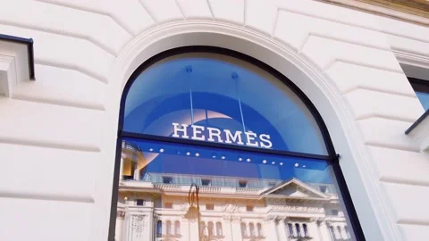 Hermes logo displayed at boutique storefront, fashion and leather goods brand Stock Footage 141741388