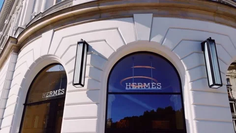 Hermes logo displayed at boutique storefront, fashion and leather goods brand Stock Footage 141741839