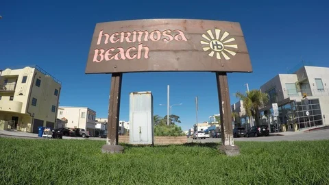 Hermosa Beach Sign - low angle with traffic Stock Footage 102478374