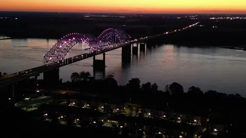 Hernando de Soto Bridge at Sunset – Drone Pullback Over Mississippi River Stock Footage 320801756