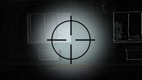 The hero of a computer game is looking for a target in an unfinished building. Video stock 110815644