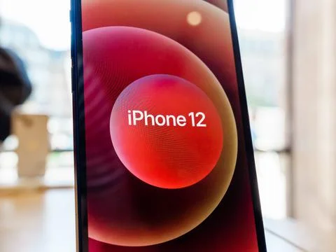 Hero object of the new red iPhone 12 on display during launch da Stock Photos