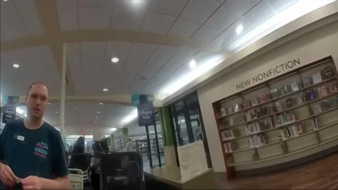 Heroic Officer Smith Executes Daring Takedown of Suspect in a Library of Ken... Video stock 254884954
