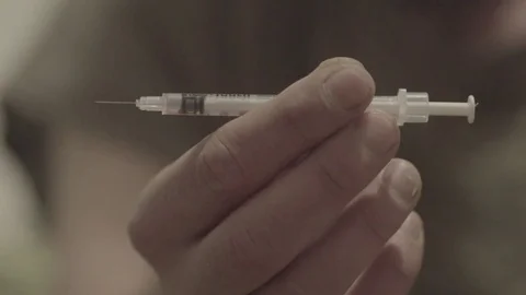 Heroin Needle Being Held Video stock 74237251