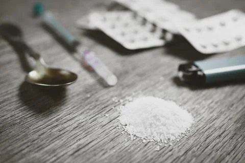 Heroin on the table closeup. Stock Photos
