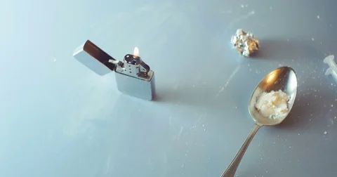 Heroine and lighter on table Stock Footage 82089225