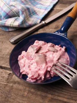 Herring with beet root sauce Stock Photos