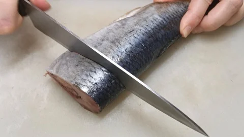 Herring cleaned from the intestines on the table for further preparation of fish Video stock 121270137