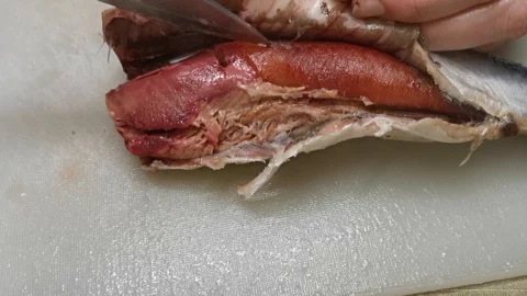 Herring cleaned from the intestines on the table for further preparation of fish Video stock 121271255