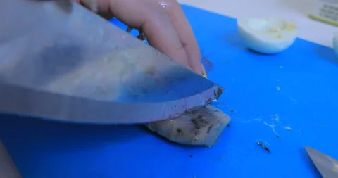 Herring is cooked in the kitchen with a knife 스톡 동영상 145934544