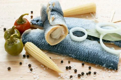 Herring fillet marinated. Cold appetizer. View from above. Stock Photos