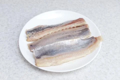 Herring fillets on a plate on the table Foto stock