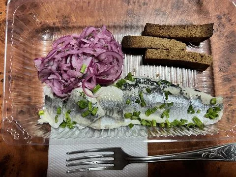 Herring with onions Stock Photos