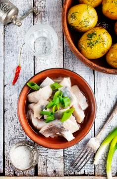 Herring with potato Stock Photos