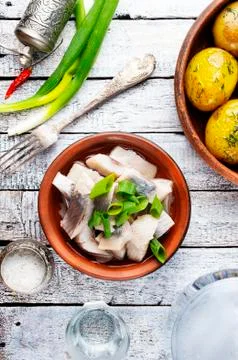 Herring with potato Stock Photos