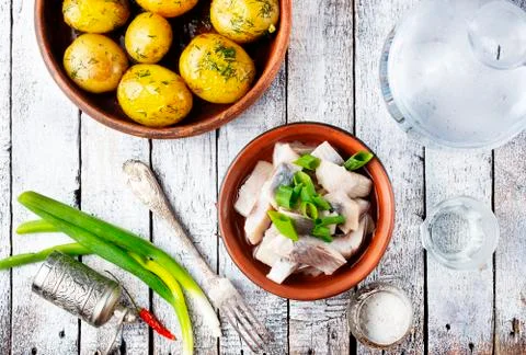 Herring with potato Stock Photos