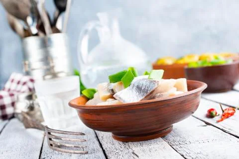 Herring with potato Stock Photos