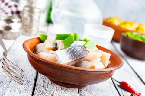 Herring with potato Stock Photos