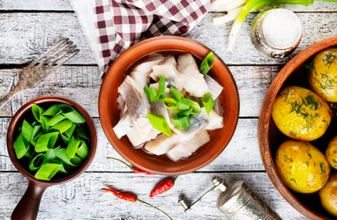 Herring with potato Stock Photos
