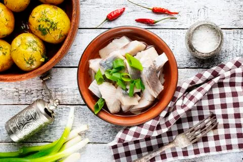 Herring with potato Stock Photos