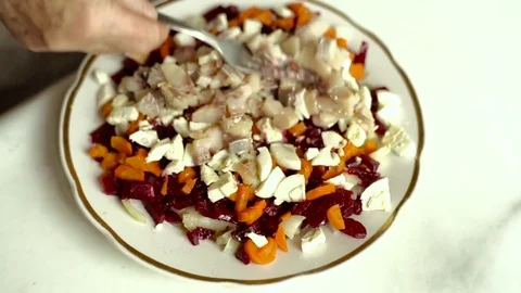Herring. Preparation of a dish herring under a fur coat. Stock Footage 70269435