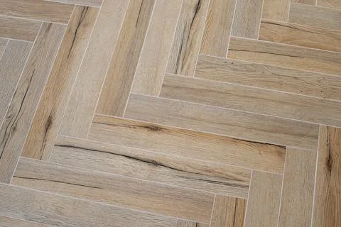 Herringbone floor made of tile rectangles resembling wood planks Stock Photos