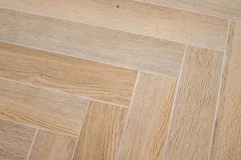 Herringbone floor with rectangular tiles arranged in broken zigzags Stock Photos