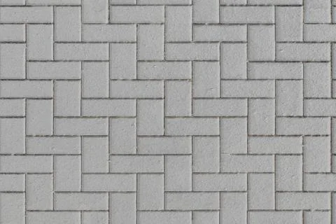 Herringbone pattern composed of white interlocking rectangular bricks. The te 스톡 일러스트