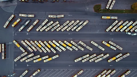 Herringbone pattern made of various buses and coaches standing at a bus depot Stock Footage 220586051