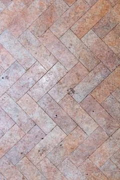 Herringbone pattern of textured clay tiles used for outdoor paving Stock Photos