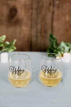 Hers and hers wives wine glasses Stock Photos